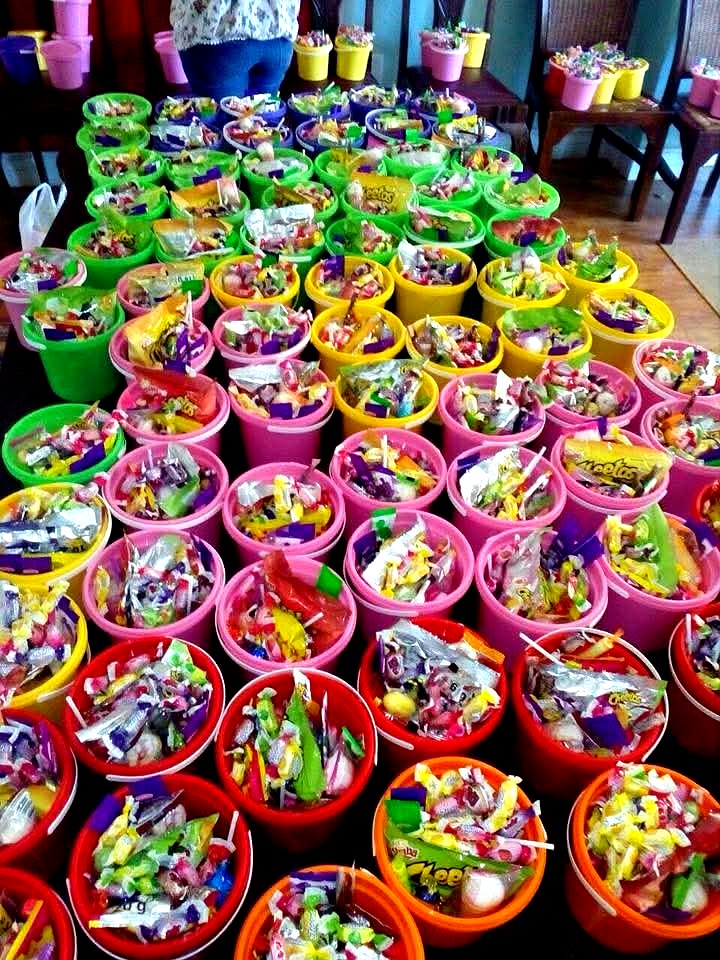 Dozens of colourful buckets filled with sweets for Children's Day