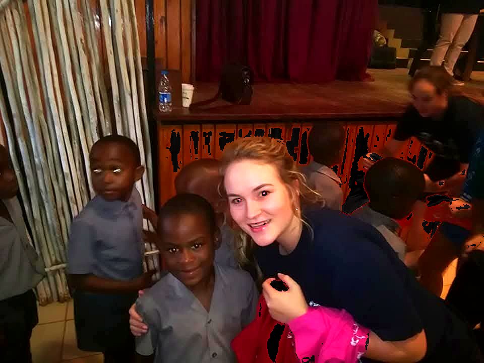 A volunteer shares a moment with a child at Children's Day