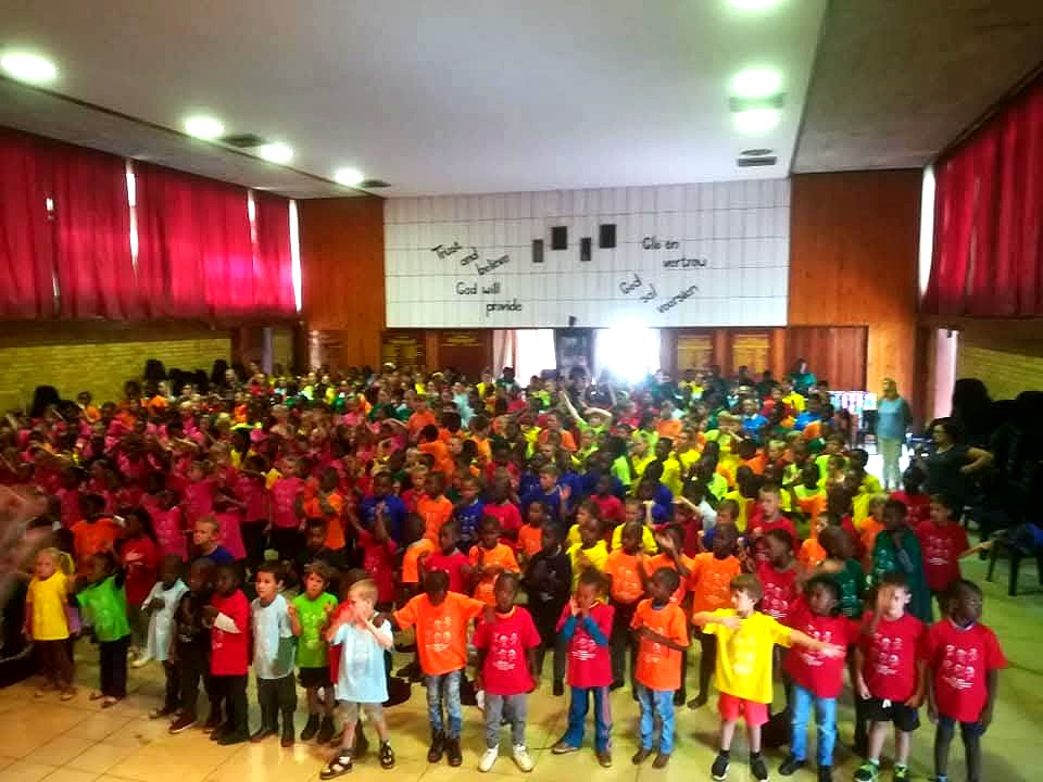 Hundreds of children in colourful t-shirts gathered for Children's Day