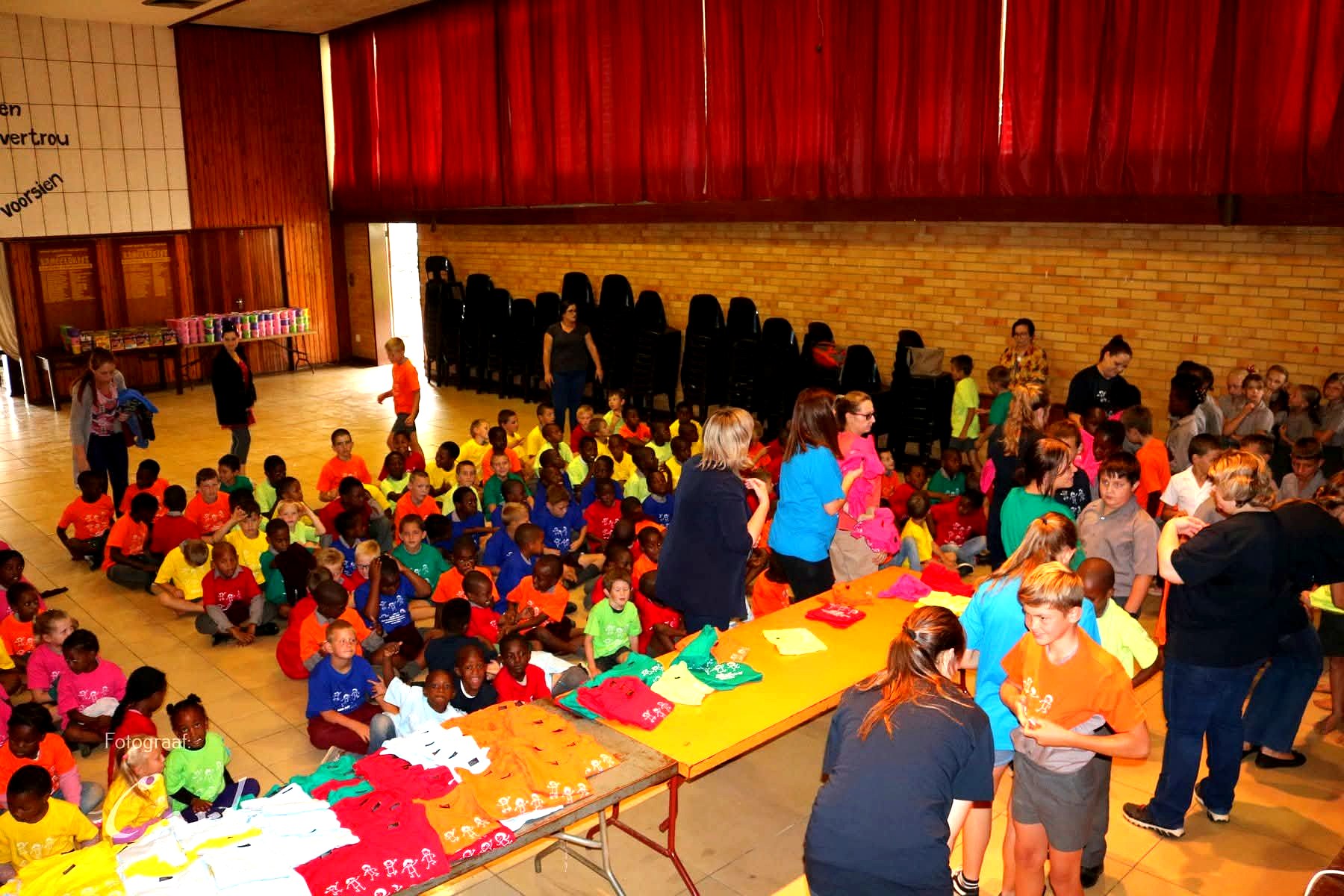 Hundreds of children gathered for the Children's Day t-shirt distribution